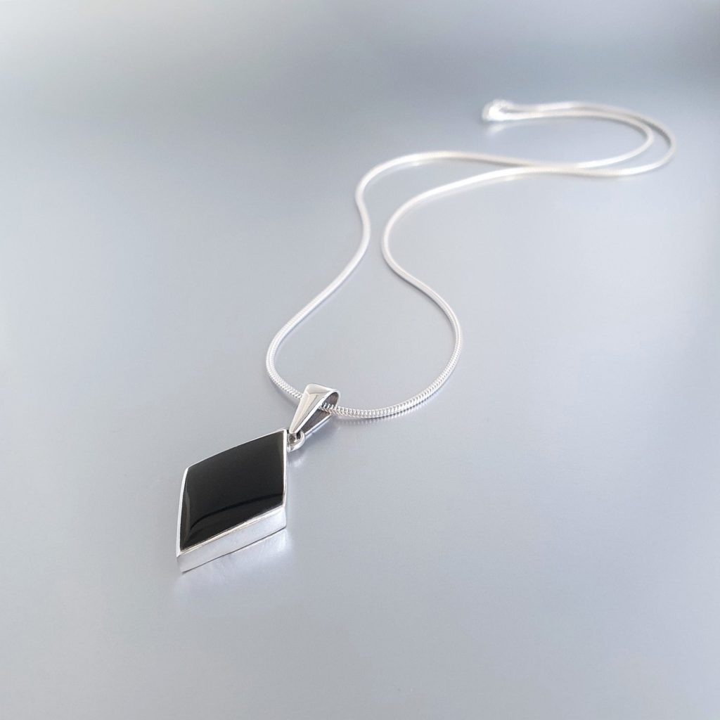 Why Are Gemstones Important? GemoryDesign | Onyx Pendant